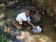 A young boy fetching contaminated water